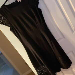 Nanette Lepore Elegant Black dress with lace detail. Size 10